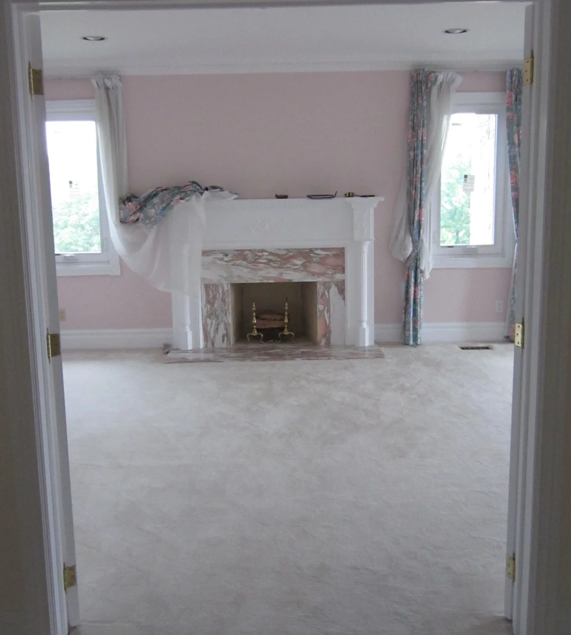 This traditional and dated fireplace was in a location with so much potential for a big "wow" moment. With some tweaks, we knew this fireplace could become a great focal point.