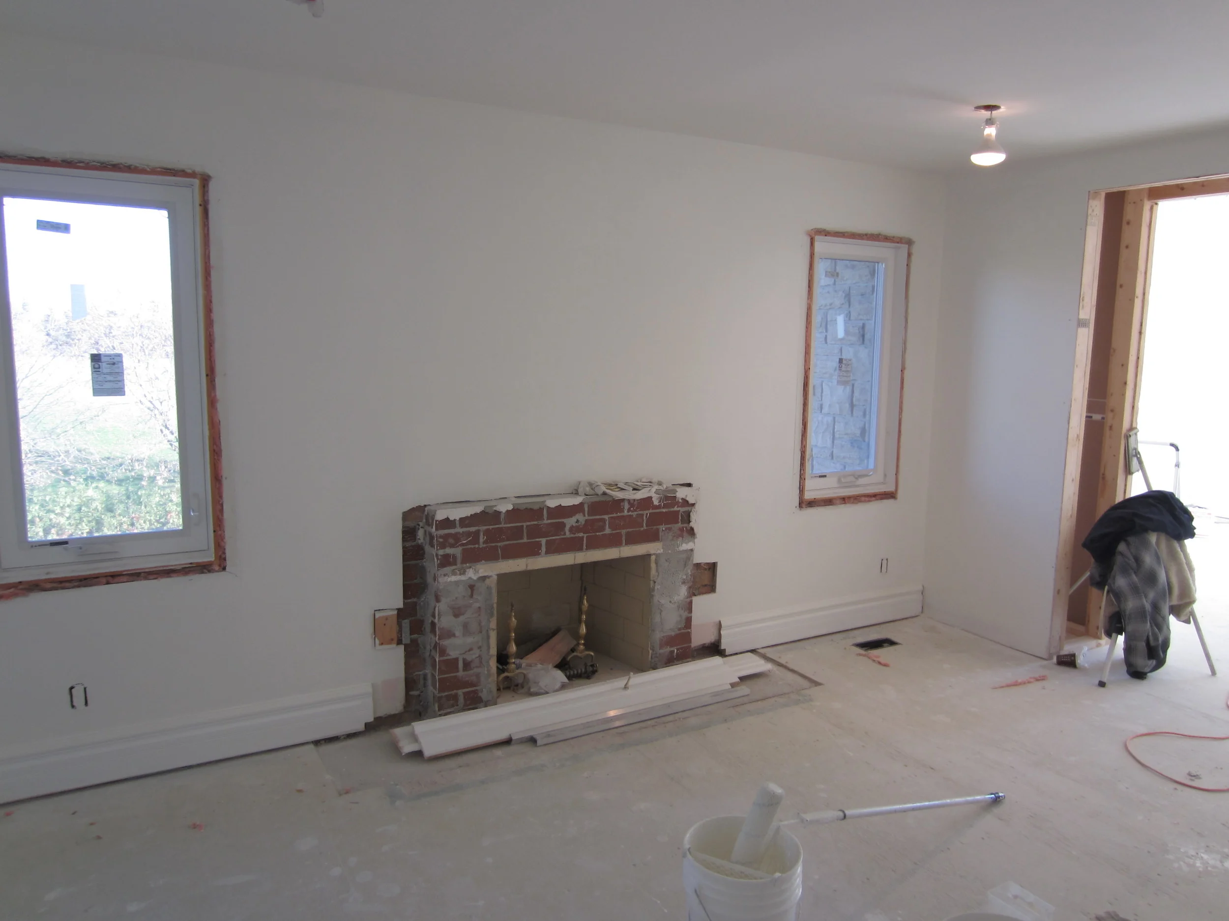 The demolition begins as we remove the stone and traditional mantel.
