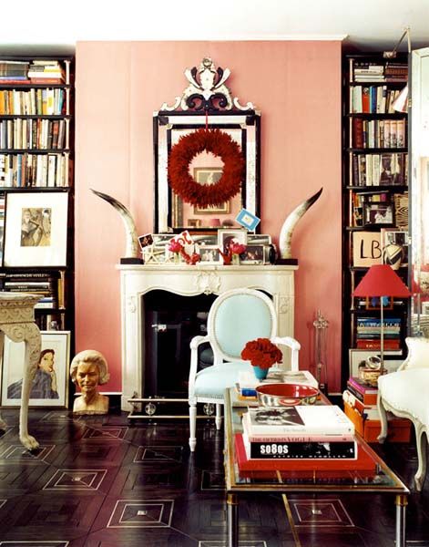 Red and black accents against a dusty pink wall can make this space feel anything but boring! ( Paul Costello )