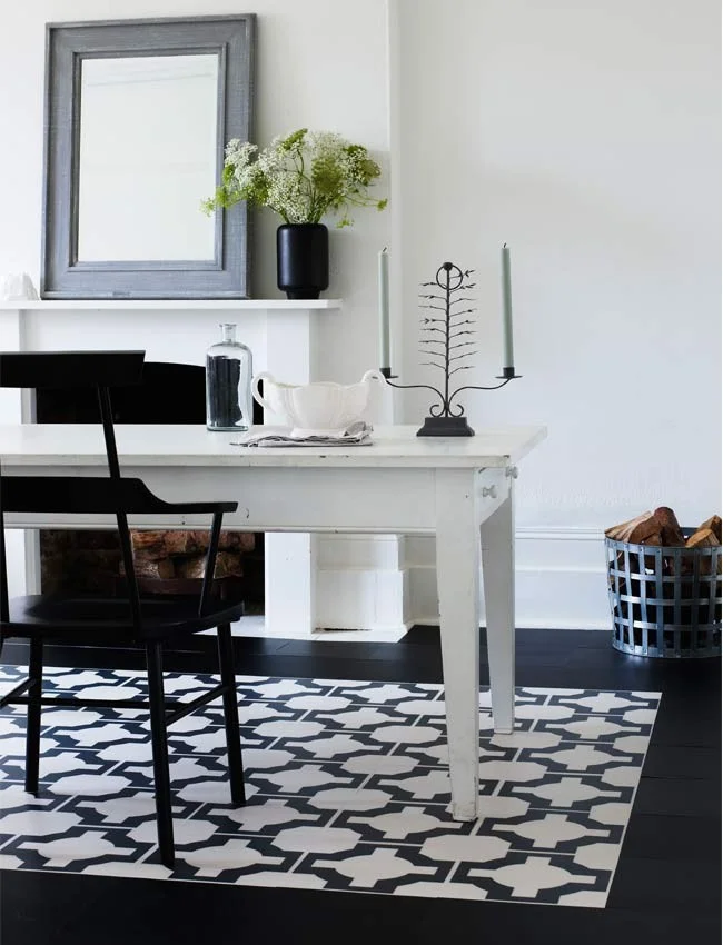 These beautiful vinyl geometric tiles, designed by Neisha Crosland for Harvey Maria, help to define the area in this dining room. ( Neisha Crosland for Harvey Maria )