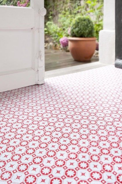 This red and white patterned flooring is so bright and cheery in this side entryway. An added bonus: it's easy to clean and durable! ( Roses des Vents for Zazous )