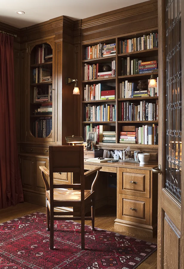 Custom-designed millwork makes this office feel like it's been in this space forever. Open shelving and glass doors make the space inviting. (Casey Design / Planning Group Inc. - photograph by Ted Yarwood)