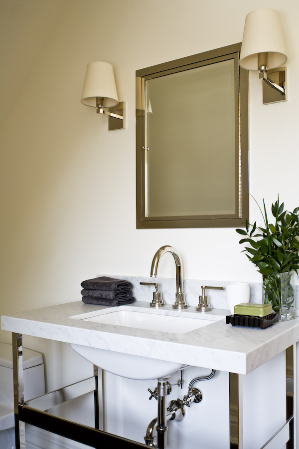 This Waterworks open sink pedestal gives our client's powder room character and the clean lines and white marble appeal to both the husband and the wife - so not too feminine or masculine but the perfect mix. (Photography by Ted Yarwood)