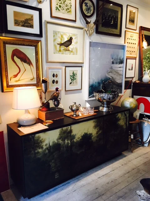 Look at the salon style art and this amazing lacquer console.