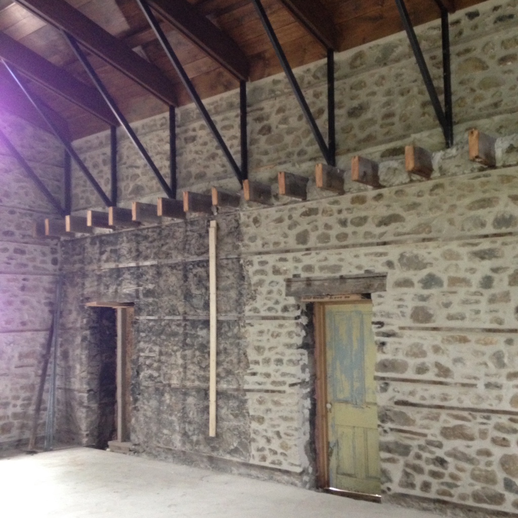 The restored stone walls, the two-storey concert space and the new structure for the roof. 