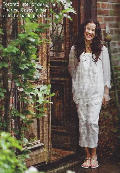 Theresa Casey in the lower courtyard of her eclectic garden.