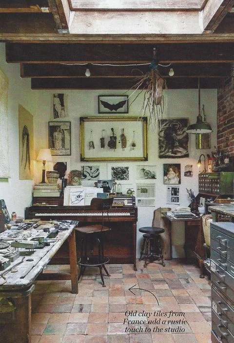 Once a garage used for storage, the studio features exposed brick, salvaged antique French clay tiles and wood beams that create a sense of age and character.