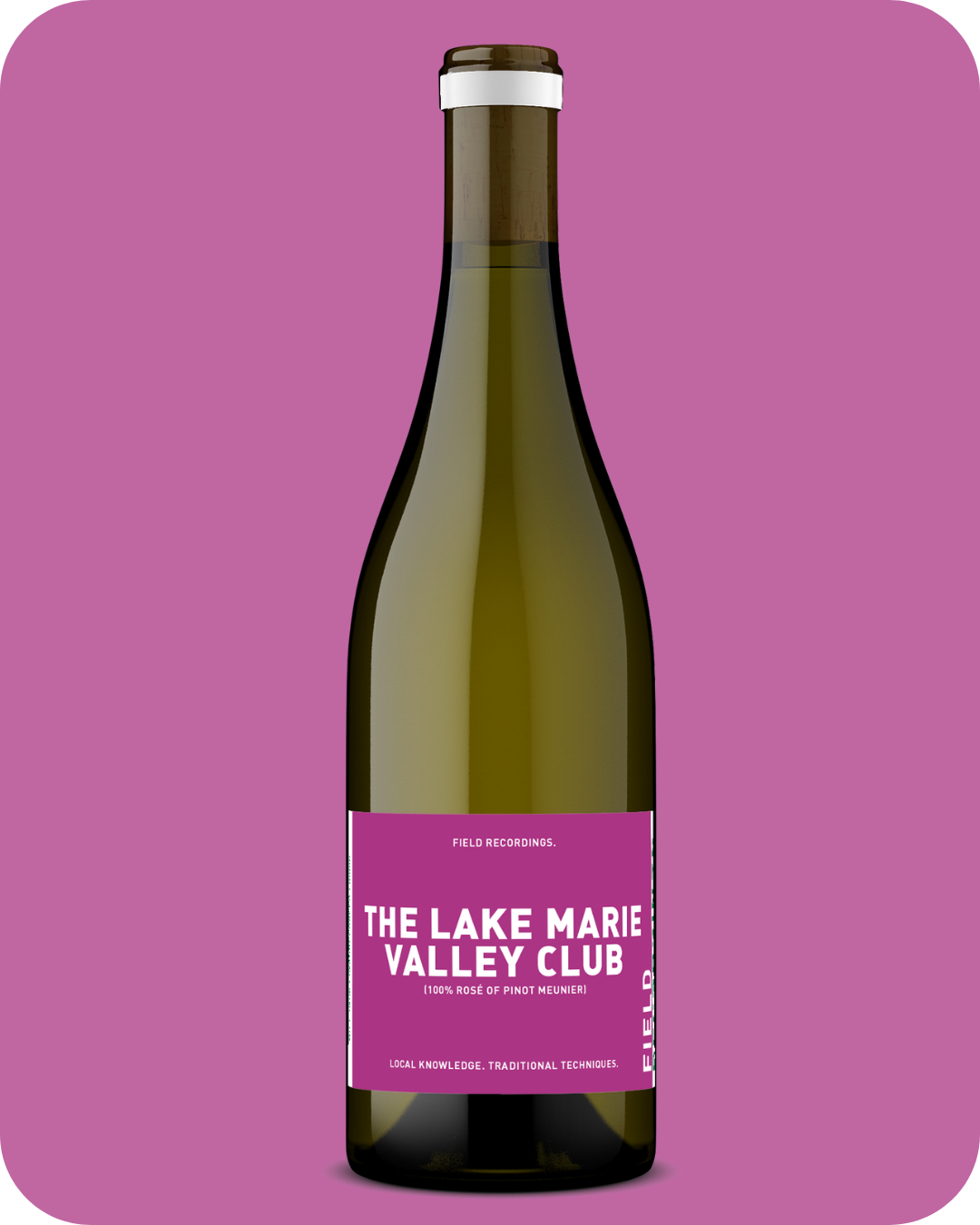 A bottle of the Lake Marie Valley Club Pinot Meunier against a pink background.