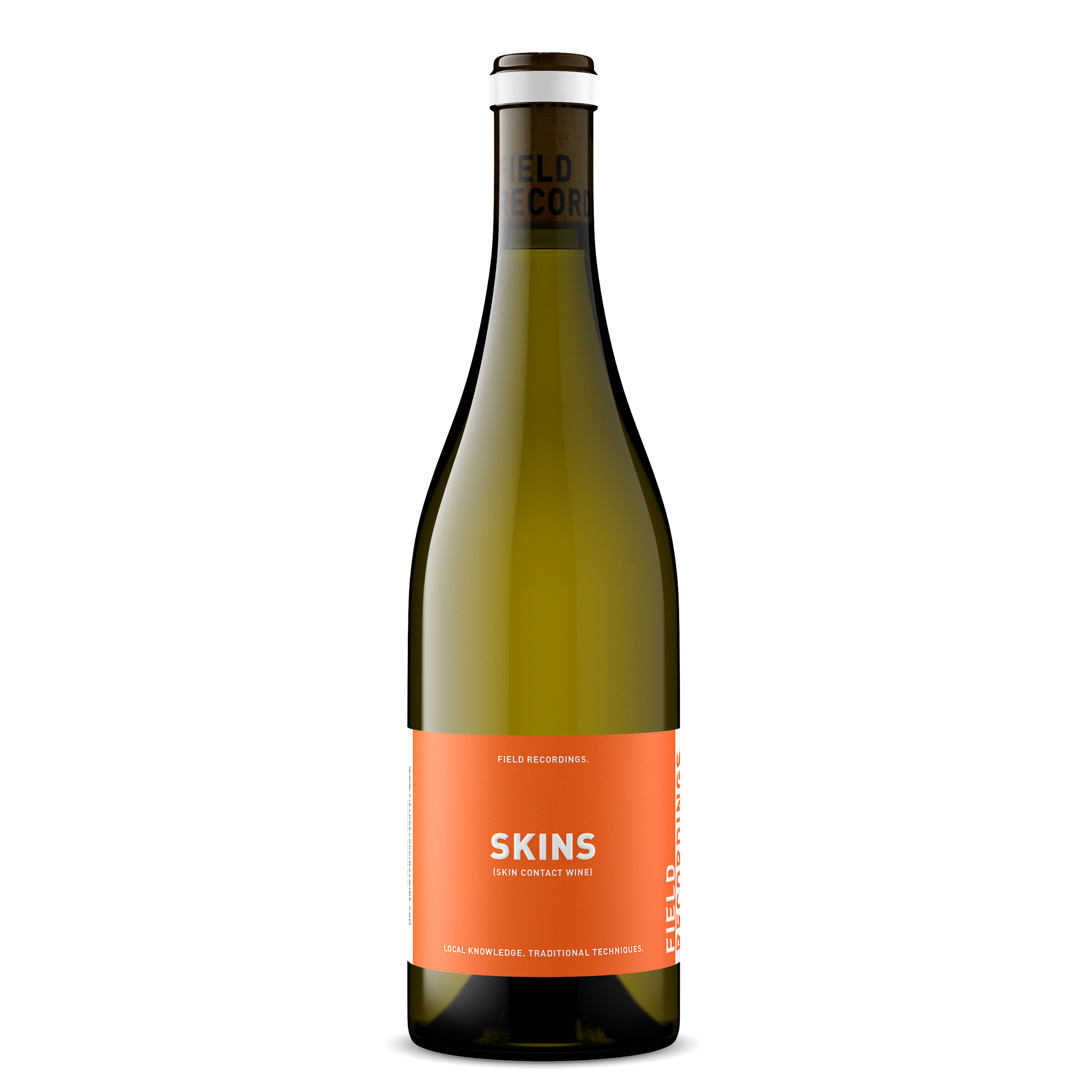 A green glass bottle of wine with a bright orange label with white text reading "Skins," a skin contact white wine by Field Recordings. The bottle has a white stripe across the top.