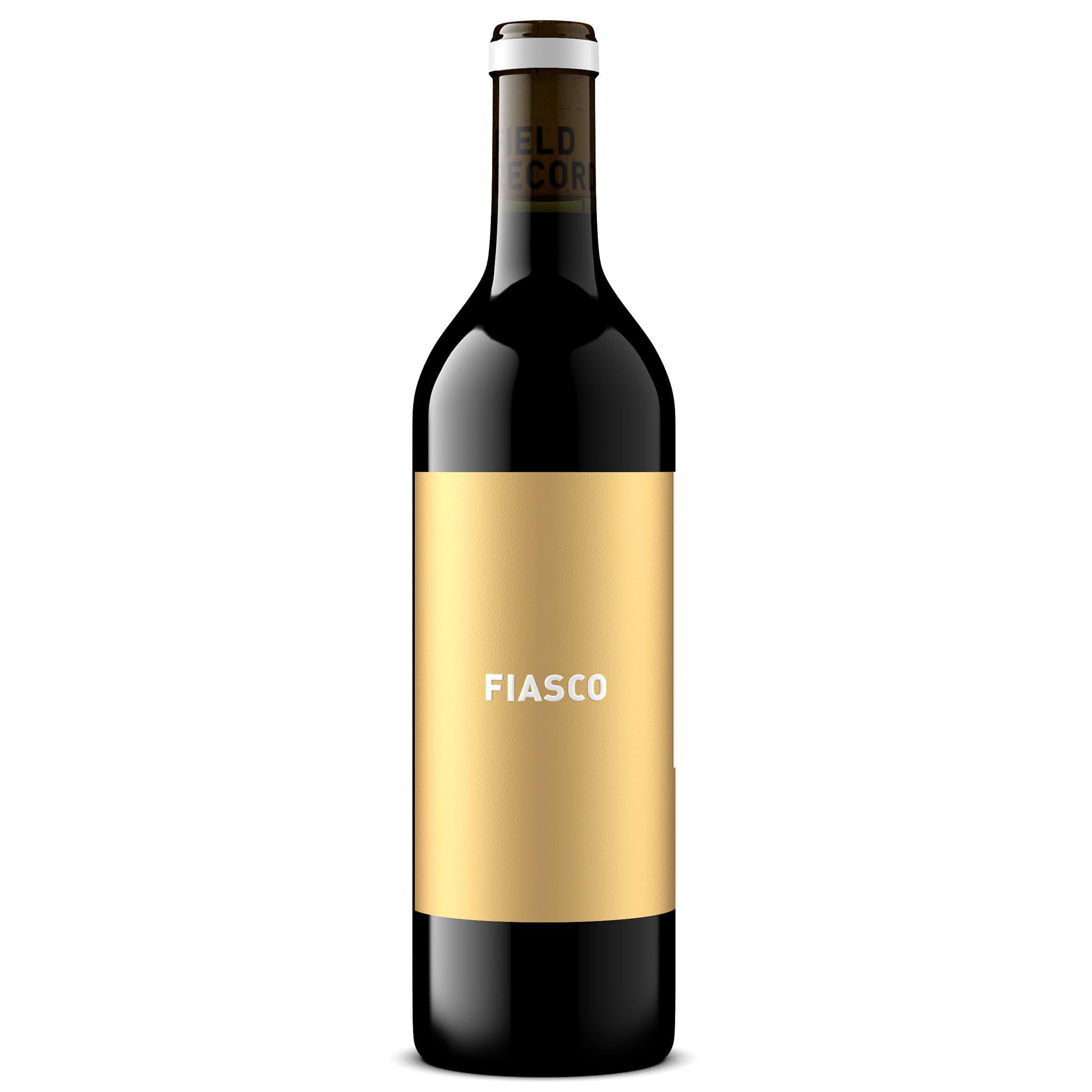 A dark glass wine bottle with a gold label that says 'FIASCO' stands upright.