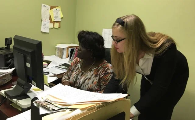 Staff paralegal Zakiya LaGrange (l) with intern Miranda Shaughnessy