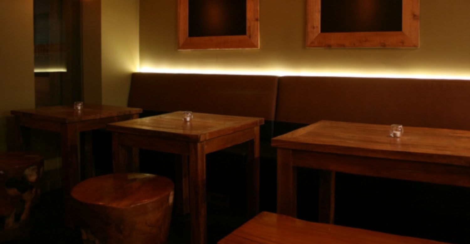 Copy of Segovia Tapas restaurant in winnipeg. Furniture. Sculpted Teak Root Round Stools