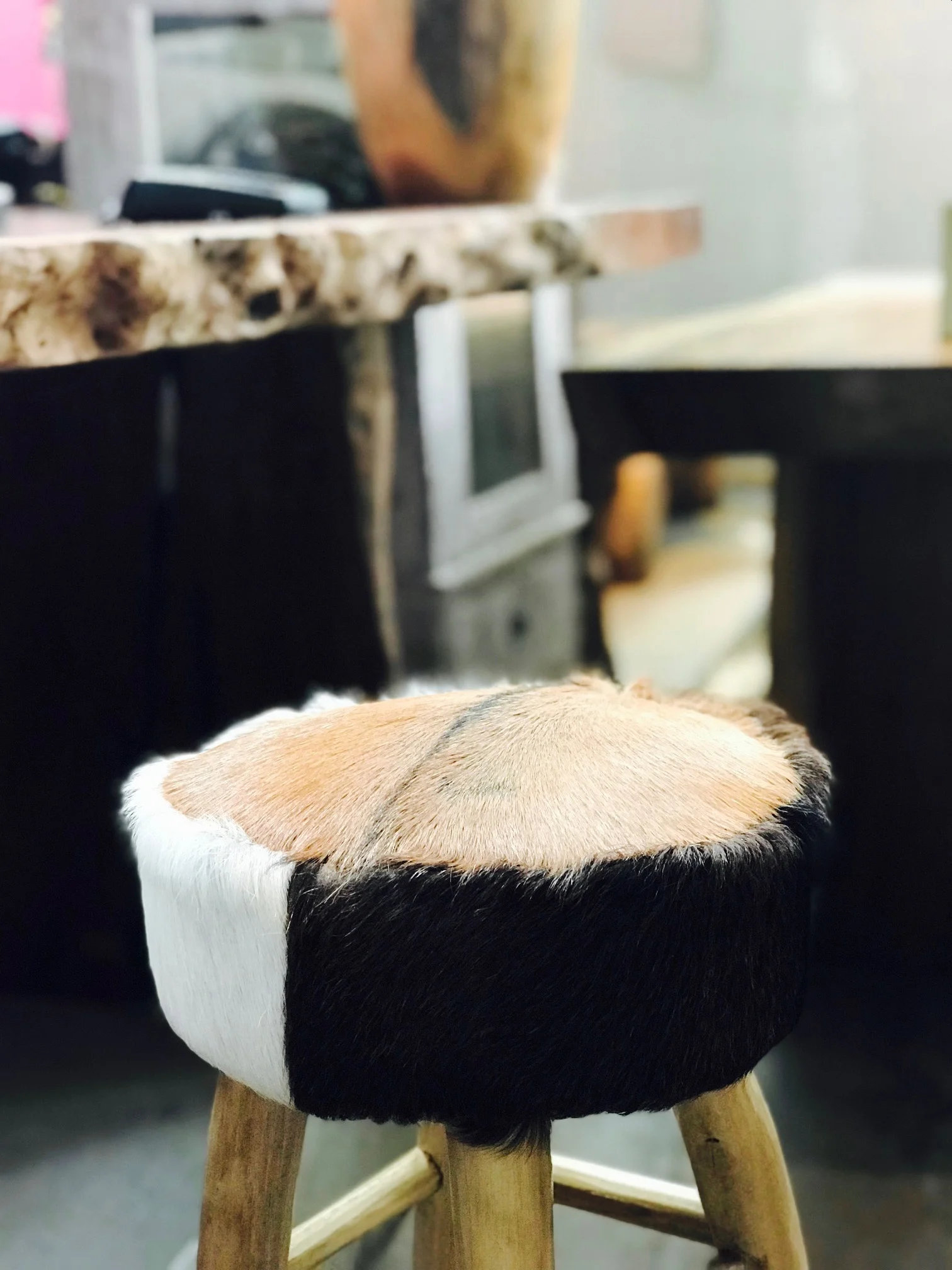 goat hair on hide stool with lychee wood live edge.jpg