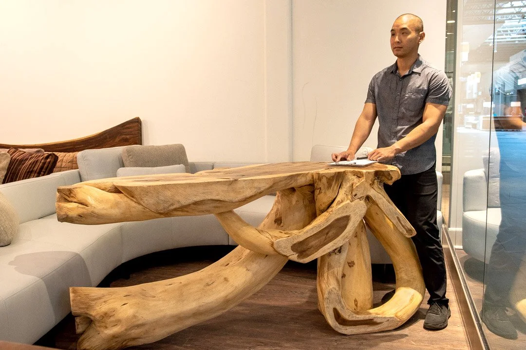 massive authentically sculpted console table with dramatic structural intricacies