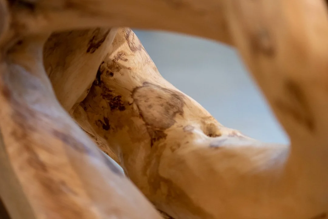 close up of structural massive console table from single block of wood