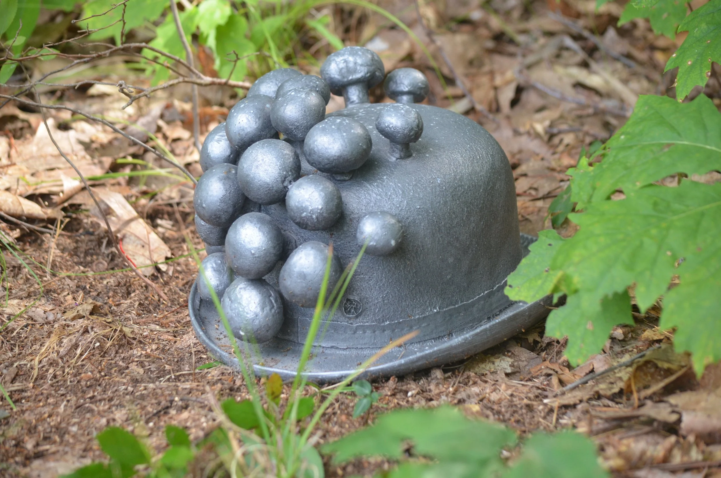 "A Father for Every Occasion" by Zach Gabbard –– Three hats, cast in metal, an artist's inheritance.