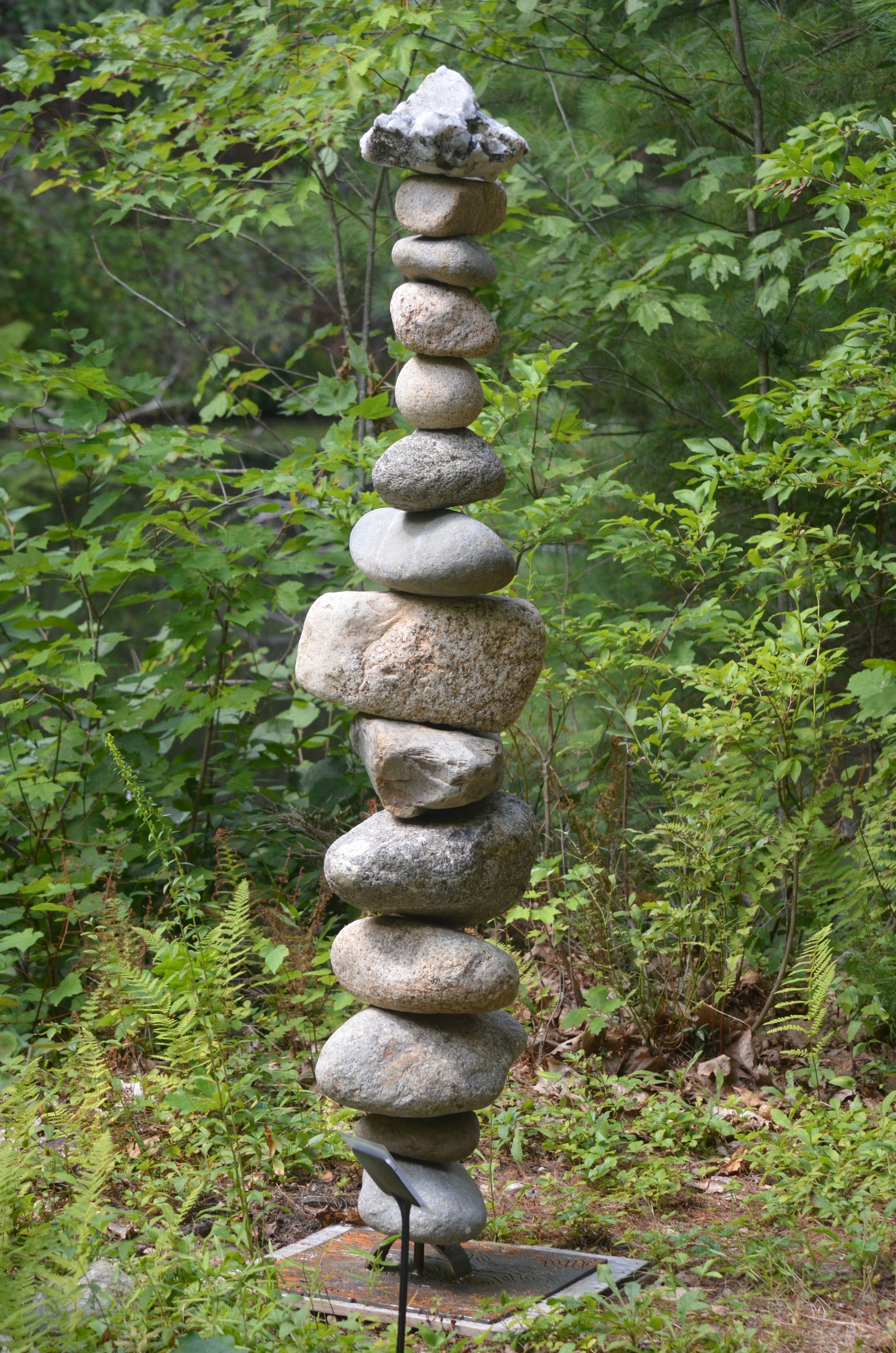 "River Cairn" by Eli West –– Is it a lighthouse, a figure, or something else?