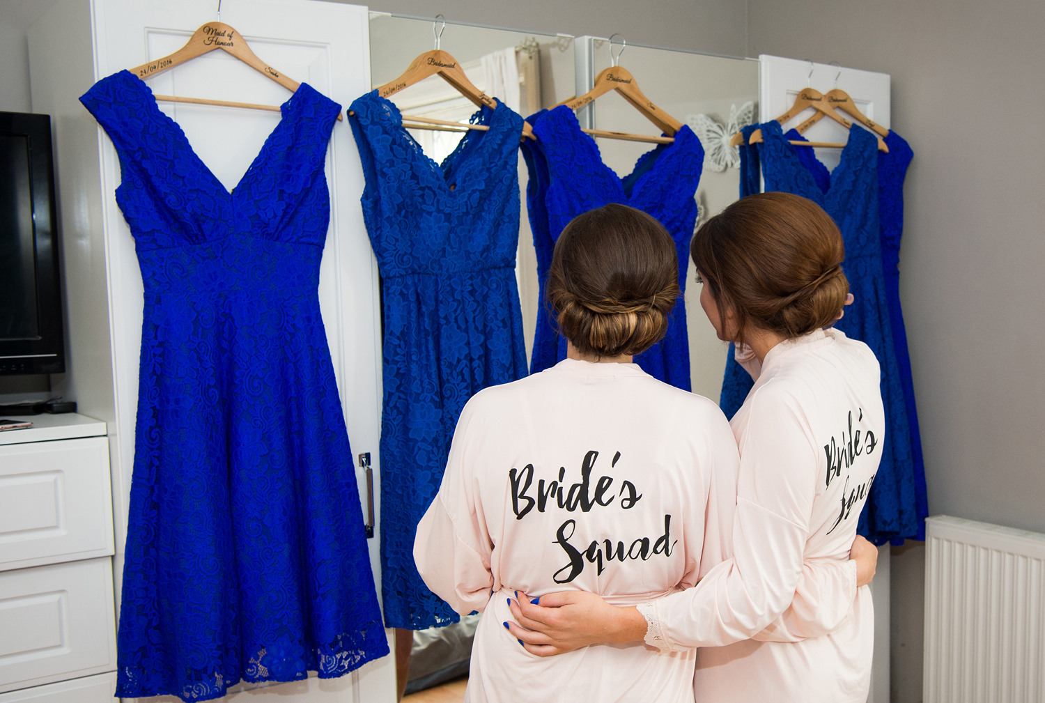 Bridesmaids looking at their bridesmaids dresses
