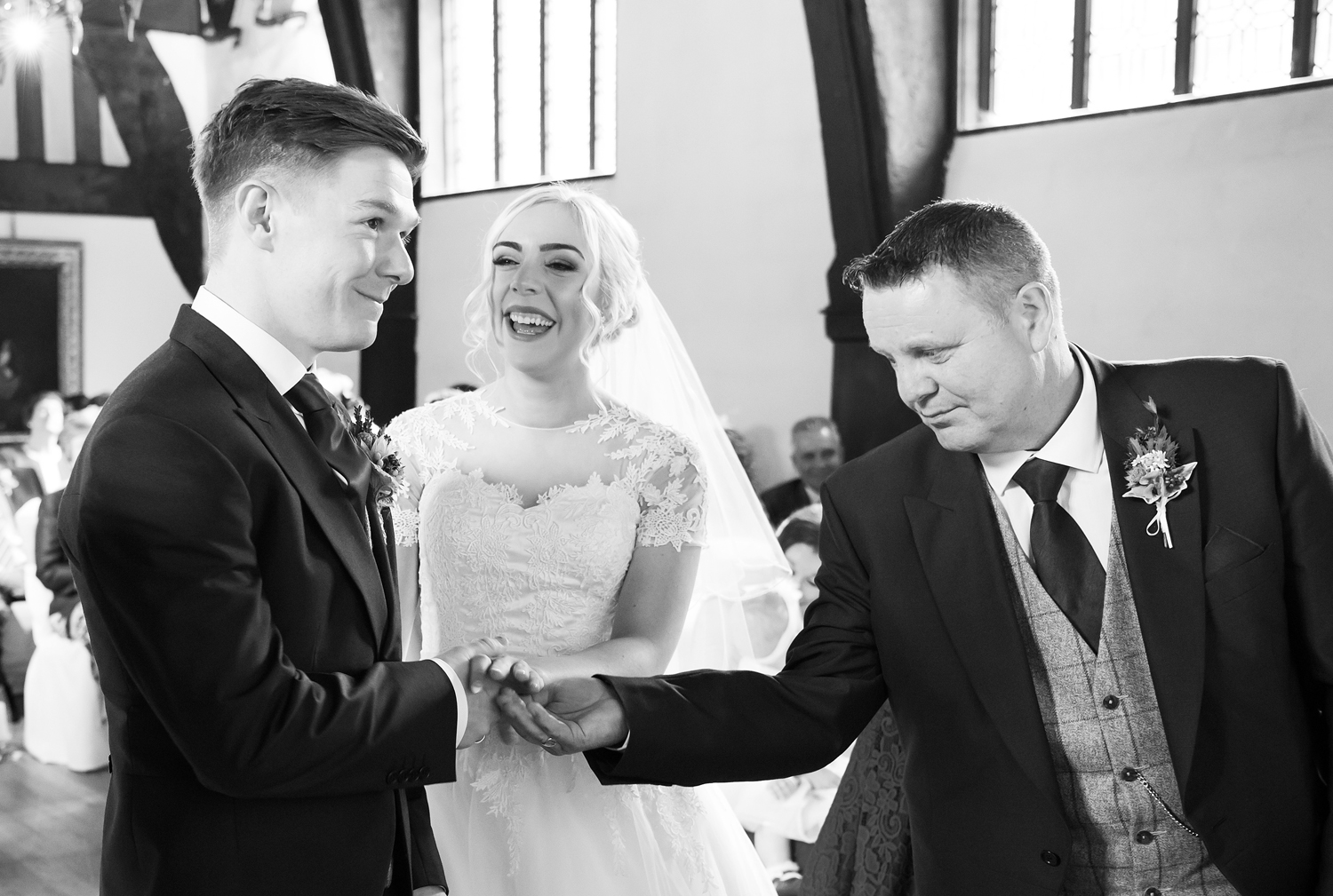Father of the Bride hands over his Daughter's hand in marriage at Samlesbury Hall