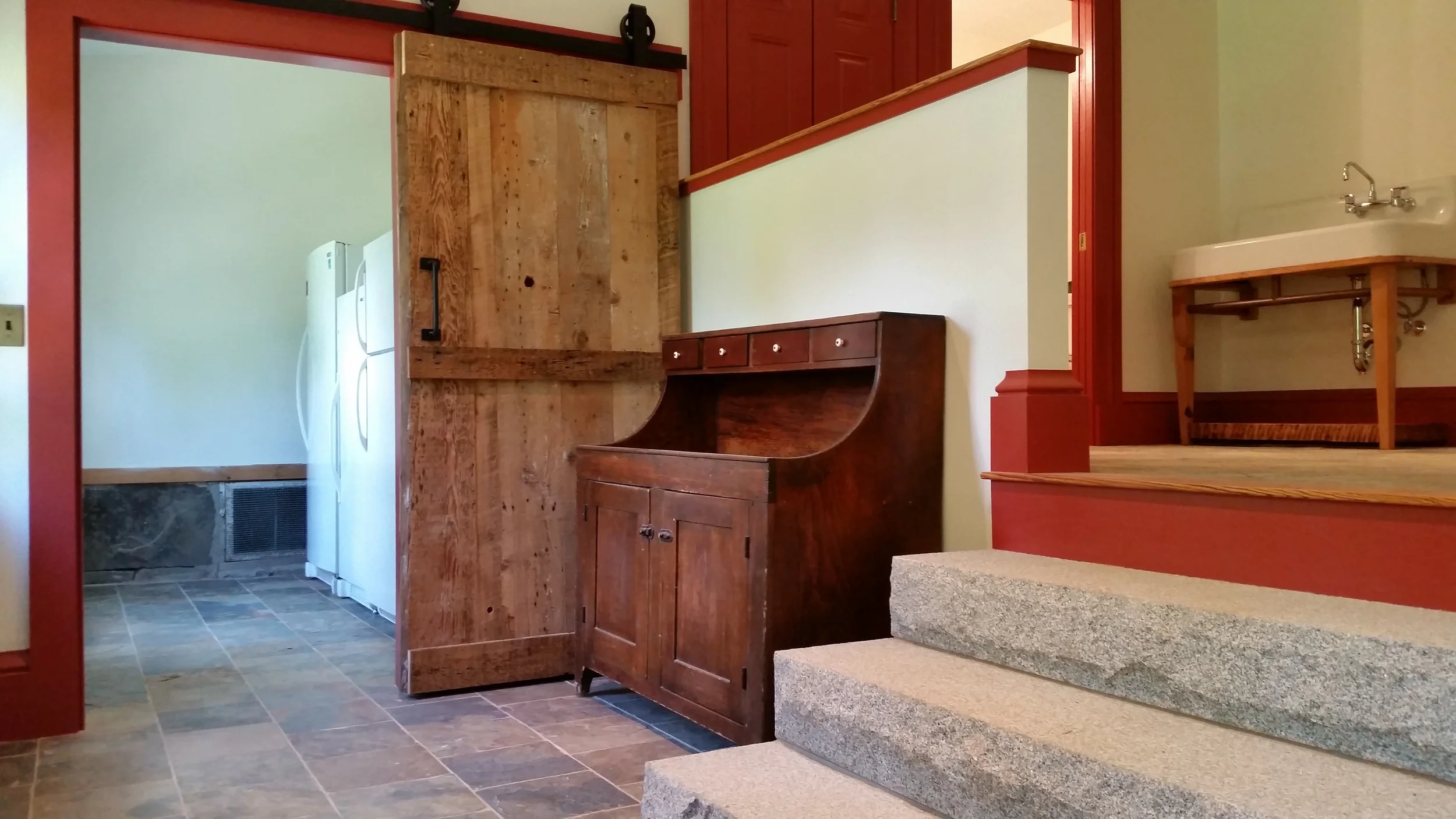 The door to the meat room is a slider on new barn hardware. That dry sink is an Pennsylvania antique that somehow made it's way up north. 