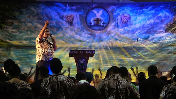 Preaching at a revival service in Apia, 2012.