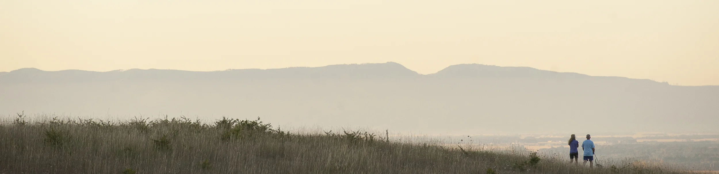 An unidentified couple walk their dog at 6:15 a.m. at Fitton Green Natural Area just outside Corvallis. Photo by Andy Cripe