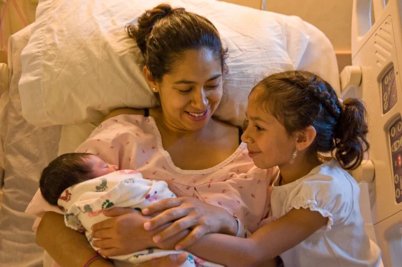 Maria Cisneros with daughter and baby Ahyzel at Providence Hood River Memorial Hospital. Photo by Peter Marbach