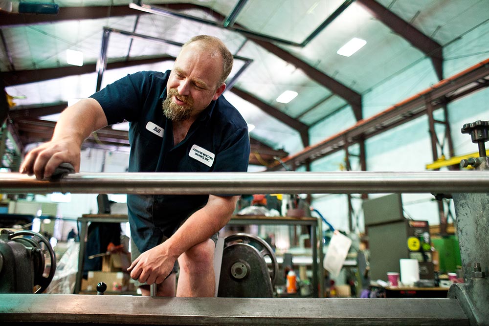 Bill Ahrens polishes a rod manufactured by Arrow Machine Works of Portland for use in a Nuclear Power Plant. His work is one of the last steps in 2 weeks of work that went into the production of this part. Photo by Sean Bowie