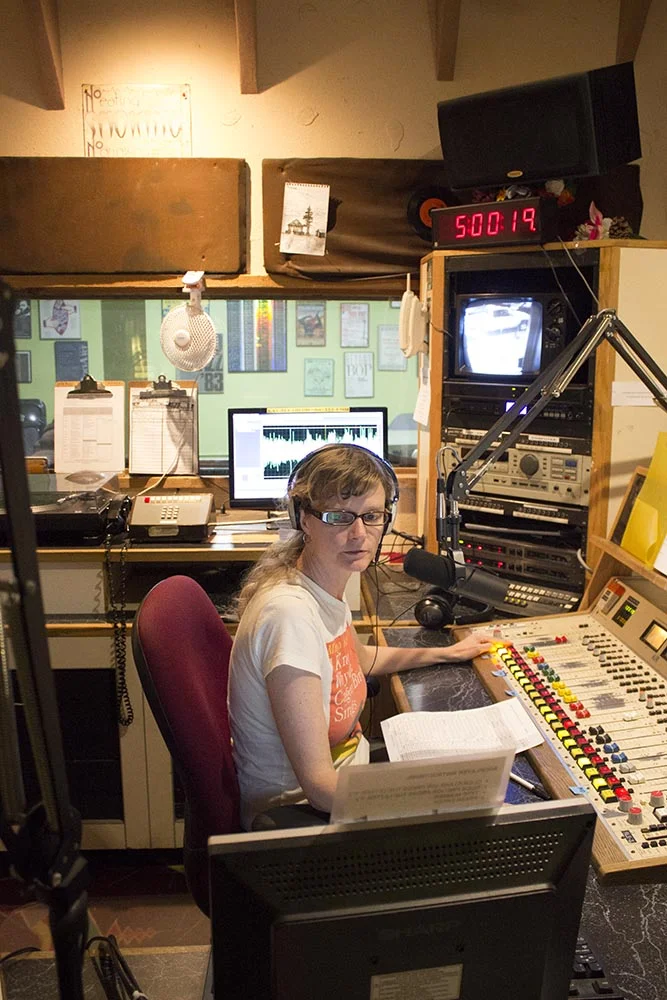 Danielle Parks engineers the KBOO-FM daily newscast. KBOO-FM is a nonprofit community radio station that has been in operation since the 1960s. Photo by Delphine Criscenzo