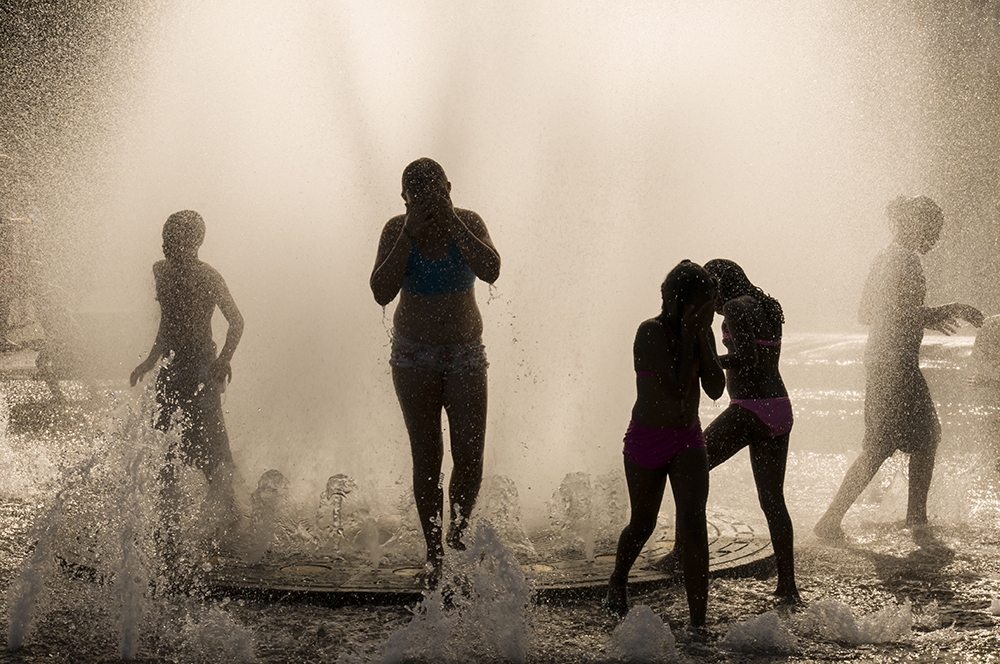 Kids cool off at the Salmon Street springs in Portland. Photo by C. Bruce Forster