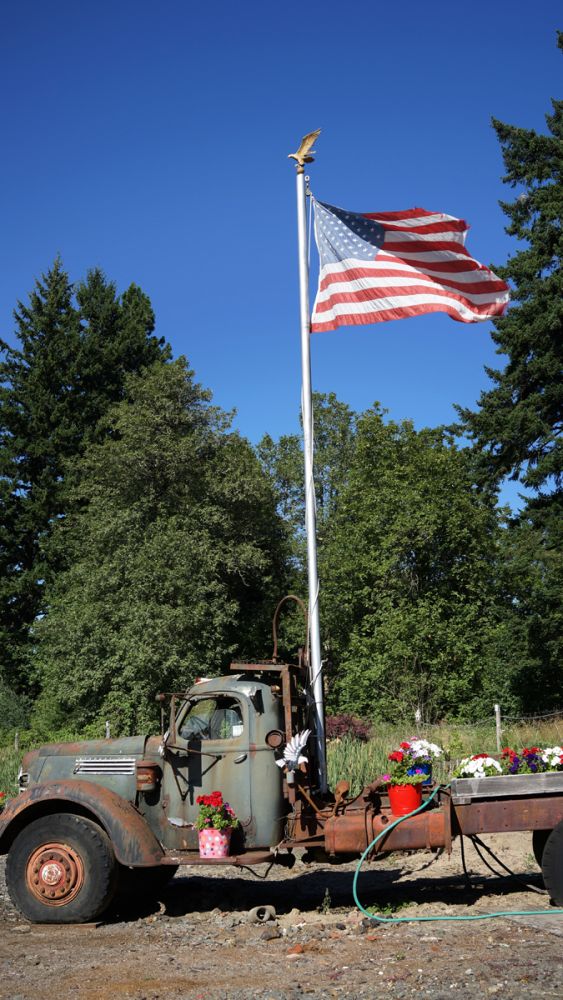Roderick Olsen created a combination flag and flower monument from this 1944 International truck. Photo by Stewart Harvey