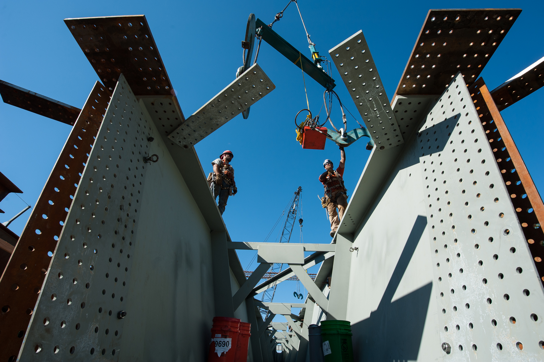 Riggers preparing to crane in a tub girder from a truck to the light rail bridge over Kellogg lake in Milwaukie Oregon. http://en.wikipedia.org/wiki/MAX_Orange_Line