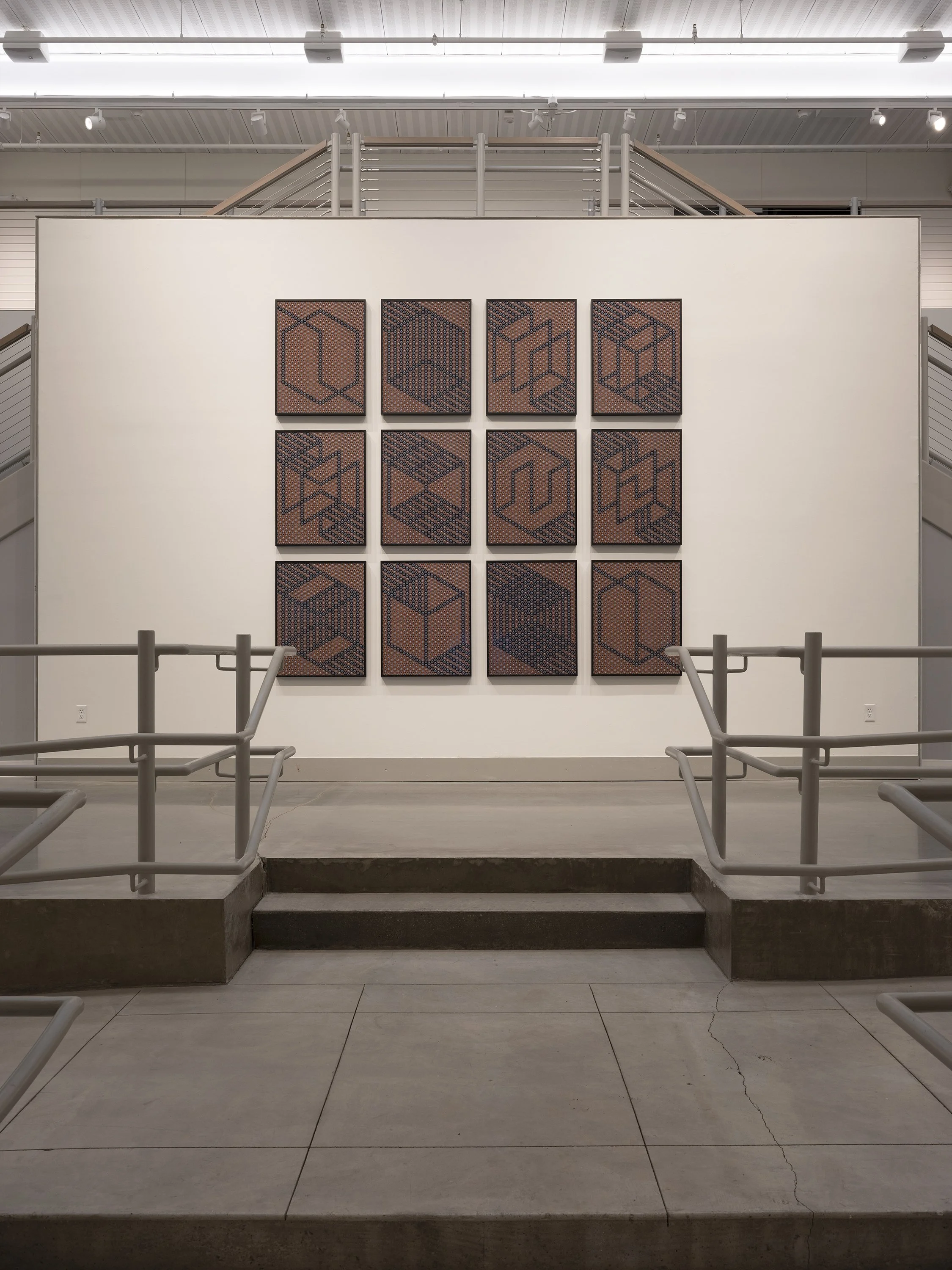  Building Energy: grid consisting of 12 battery formations, approx: 9 x 9ft, shown here in 2023 at the show “Zero Toys and Death of Print” at the Umbrella Arts Center.  