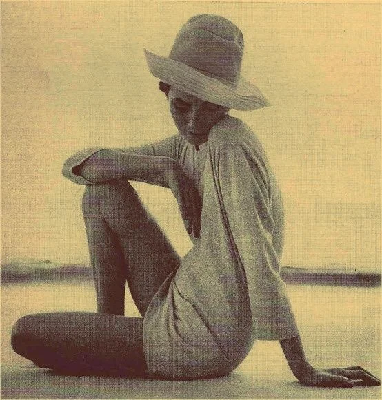 Woman sitting on a beach in a tunic via Pinterest