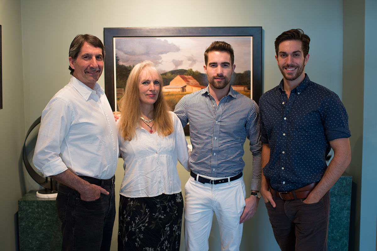 Jason, Holly, Jordan and Justin Drake in front of "Storm Clouds Over Boone."