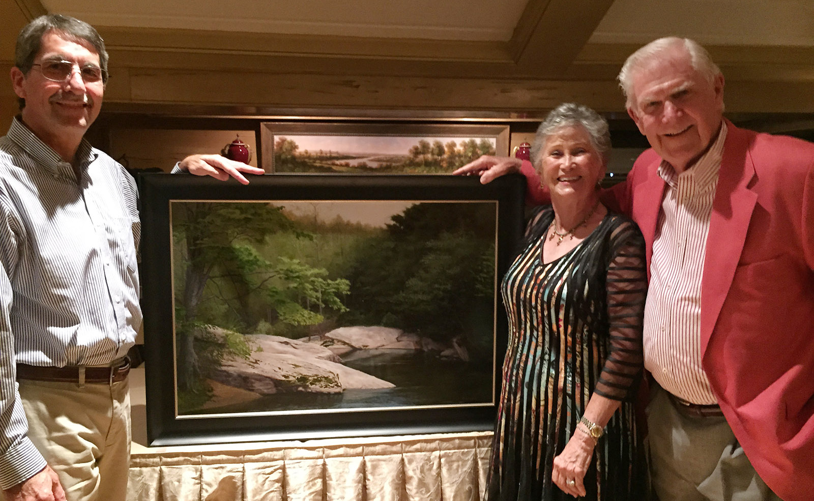Jason showing his new painting River Bend with buyers Jim & Barbara Whitton