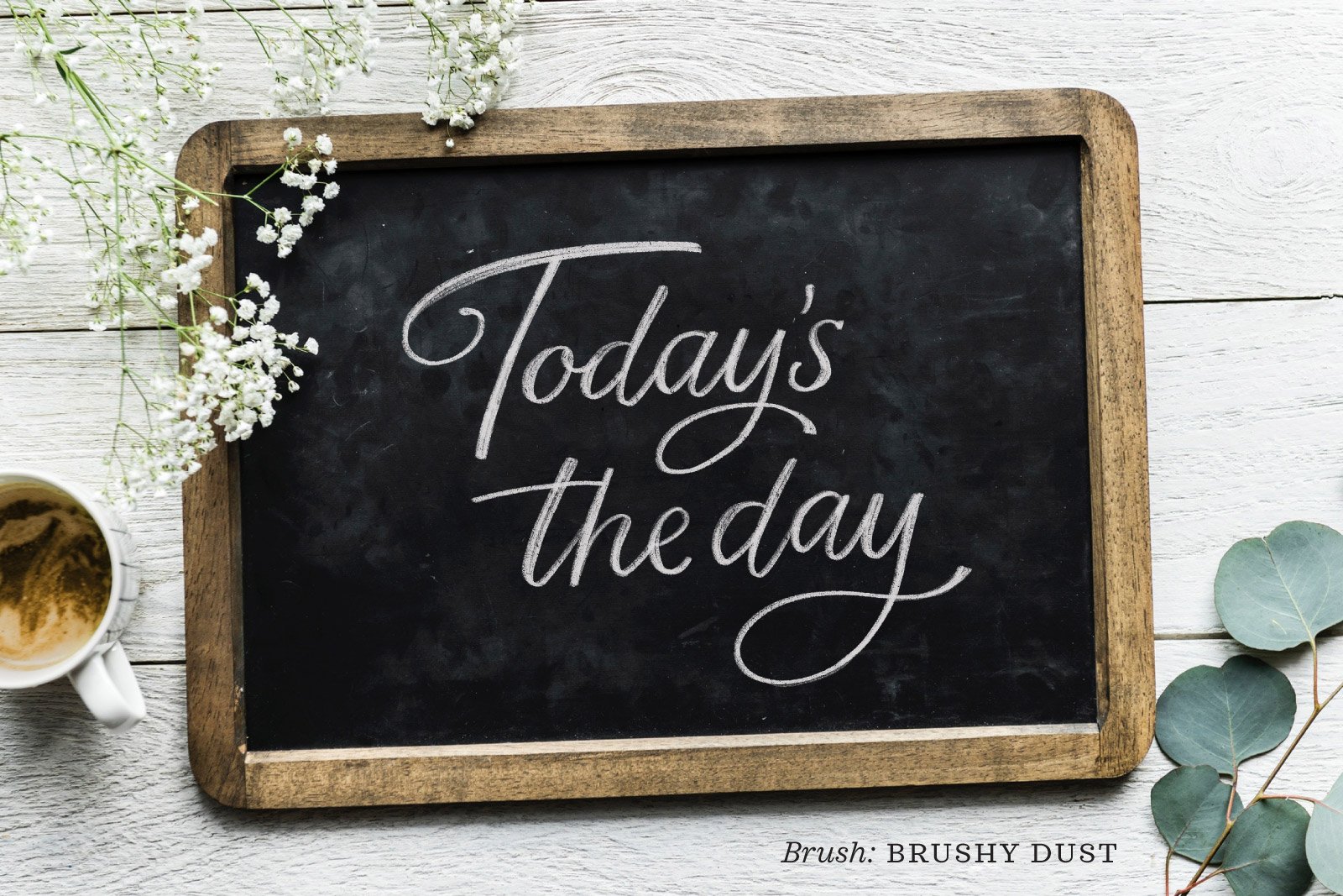 A mockup of a small slate chalkboard with the words “Today’s the day” in digital chalk lettering, created using the Chalk Lettering Procreate Brush Kit for iPad Lettering by Molly Suber Thorpe