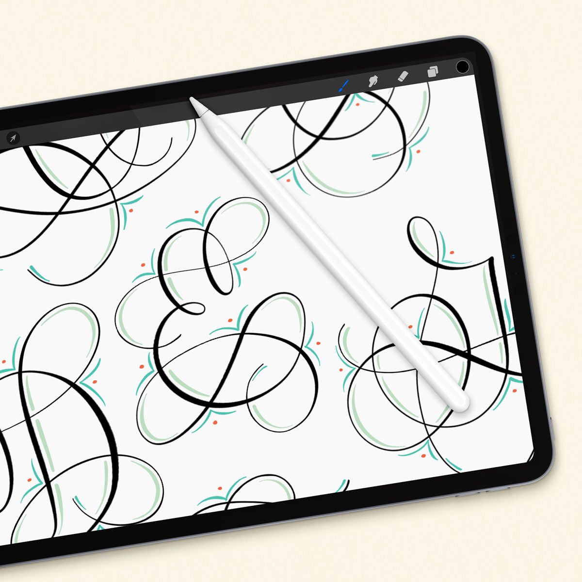 iPad screen displaying a Procreate screen with flourished calligraphy capital letters drawn with a pointed pen Procreate calligraphy brush