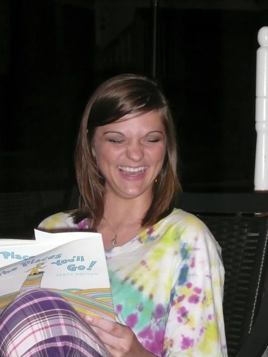Me opening my high school graduation present! A cruise!...No judgement on my excited face. 