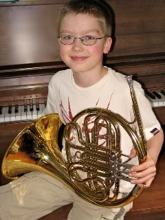Kyle Almquist ('11), a French horn player.