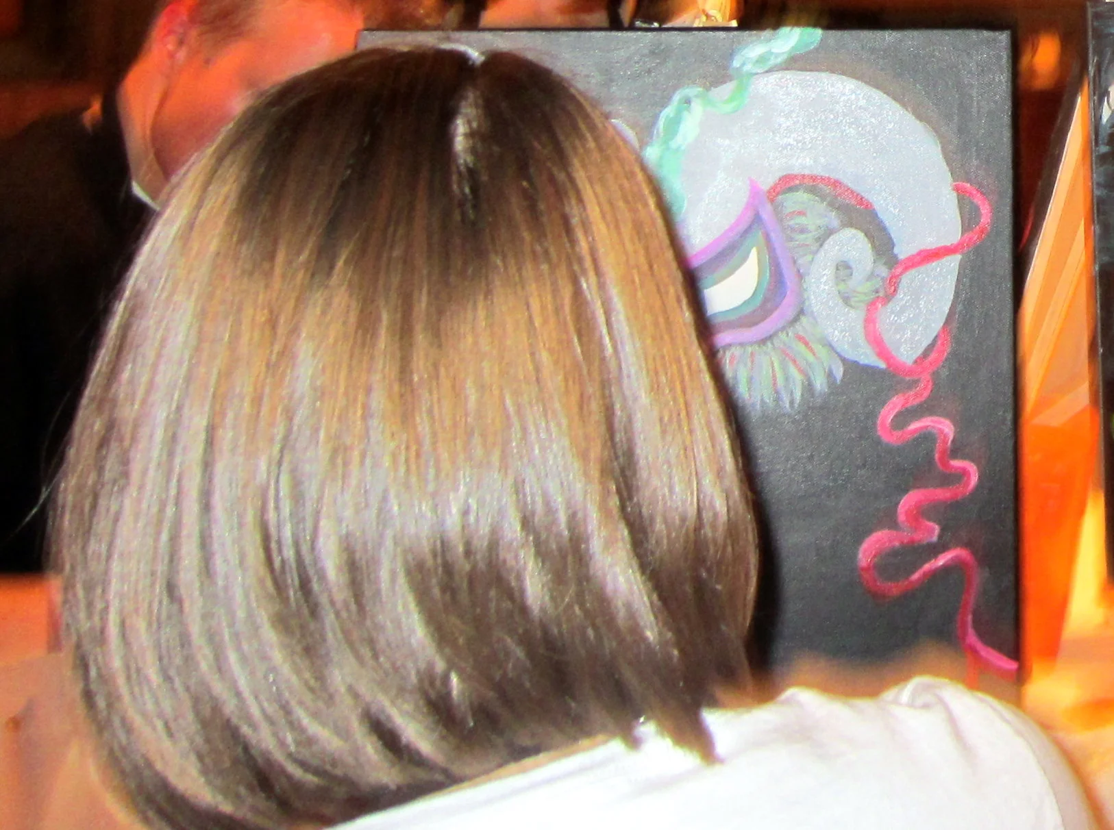  The mask is peaking around the side of her head at us! 