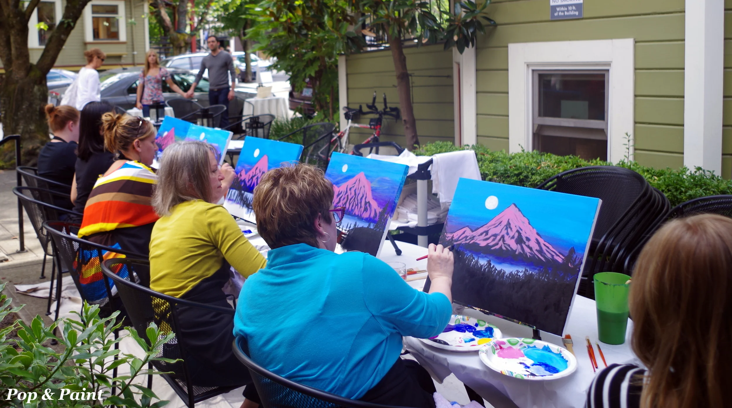 Even those walking by love watching the painting!