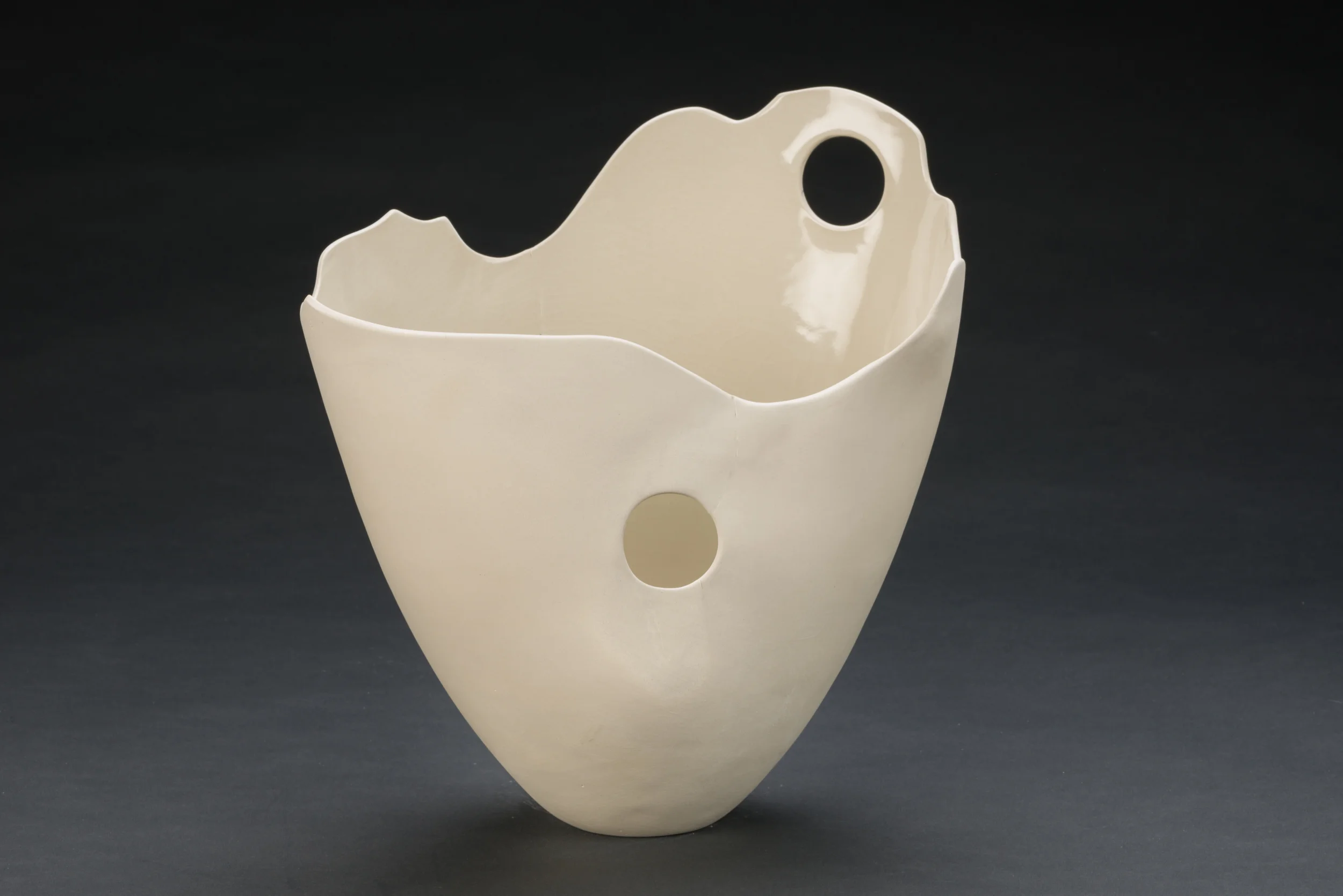 white tall vase with two holes.jpg
