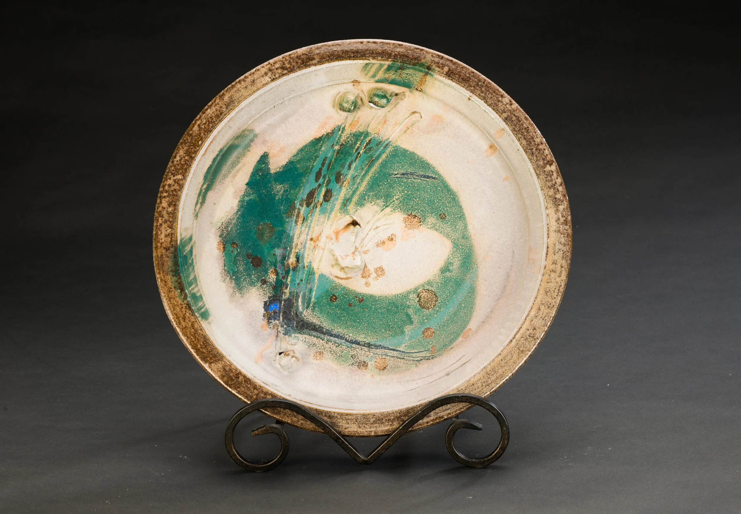 Wheel-thrown and alterned plate, circa 1984.