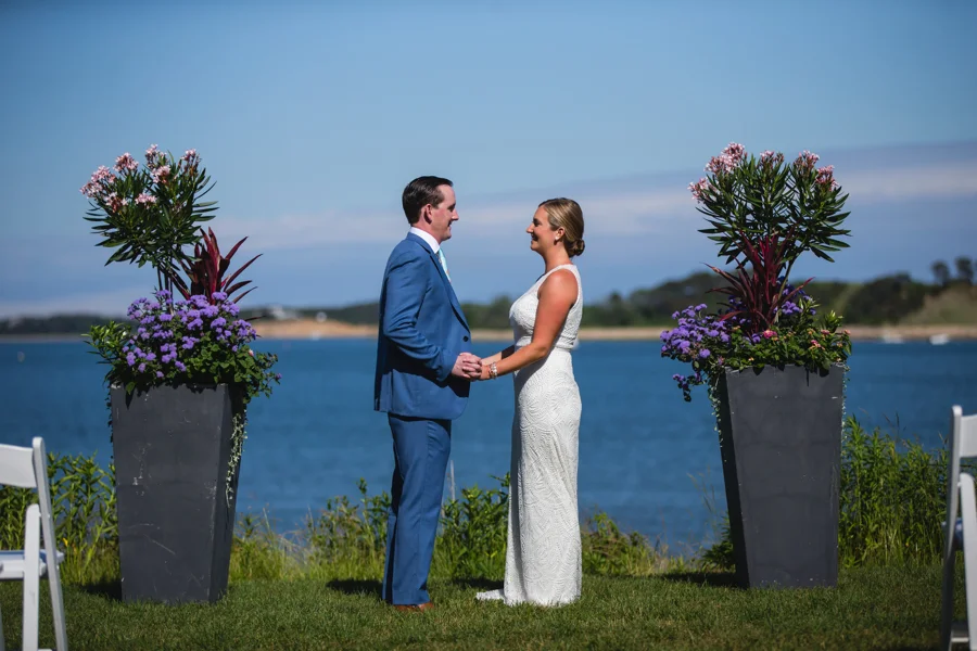 Wedding couple on the lawn with water background Harwich