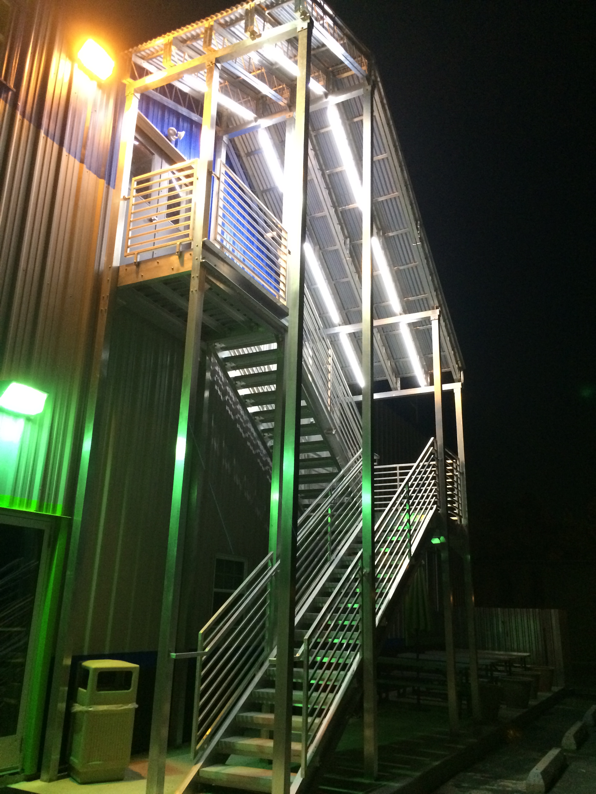 aluminum staircase with open risers and concrete treads.JPG