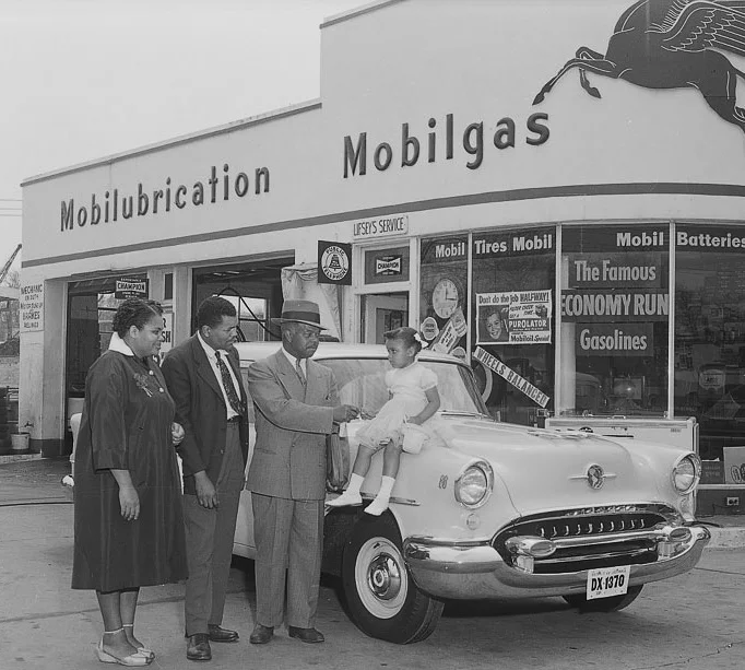 An African-American family with their new Oldsmobile in Washington, D.C., 1955