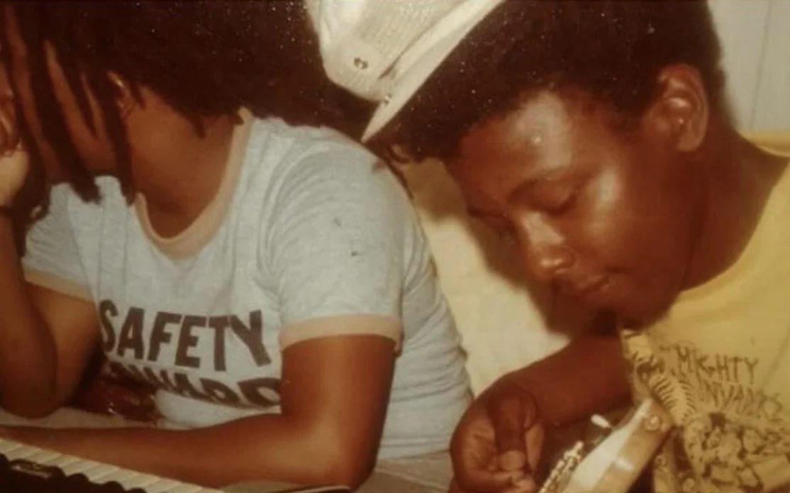 Ichelle and Asher Cole in Jamaica in the 1980s. Ichelle on the keyboard and Asher on the guitar.