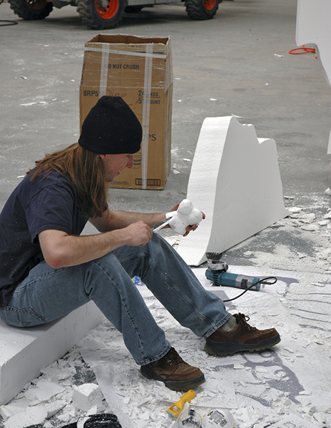 A younger me carving a pedal ungal. Look at that hair - what a hippy!