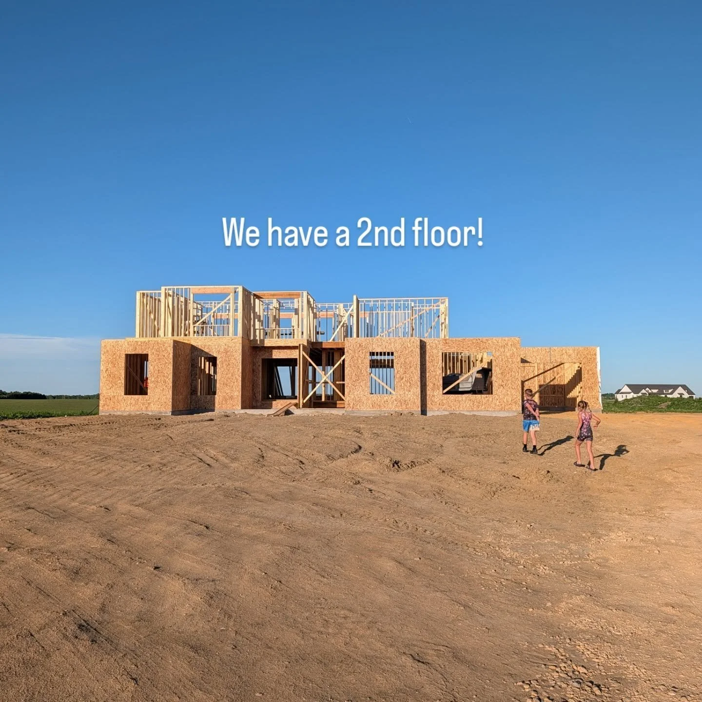 The 2nd floor is up! I'm too afraid of heights to use the ladder to check it out but Nate's brave!

The 2nd floor has 3 bedrooms, 2 baths, an office and a "game room". Basically the kid fun zone. Don't worry, there's extra insulation going 